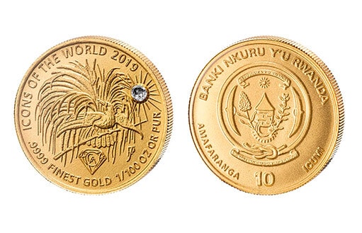 коллекционная монета из золота, инкрустированная небольшим граненым алмазом, посвященная райской птице