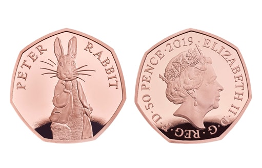золотая британская монета с персонажем детских сказок