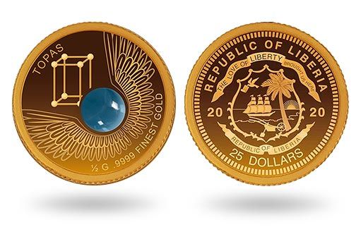 либерийские монеты из золота украшает топаз